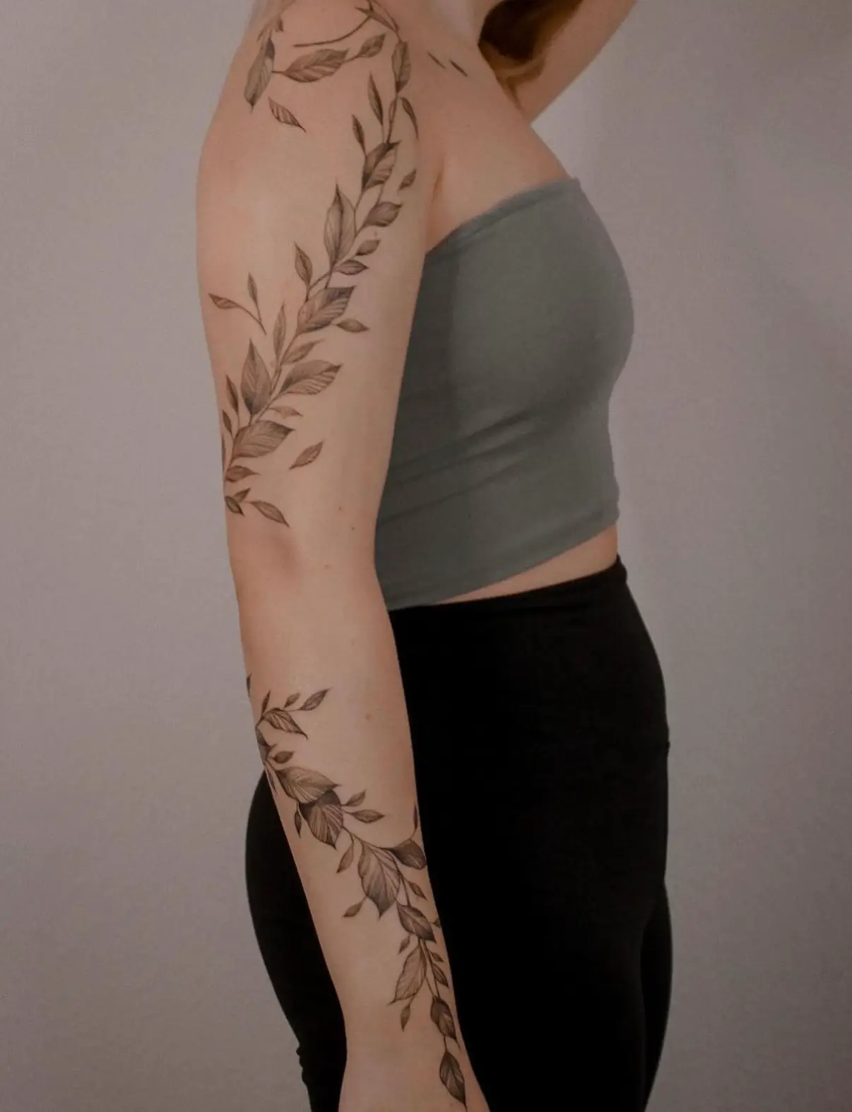 floral wrapping around arm tattoo